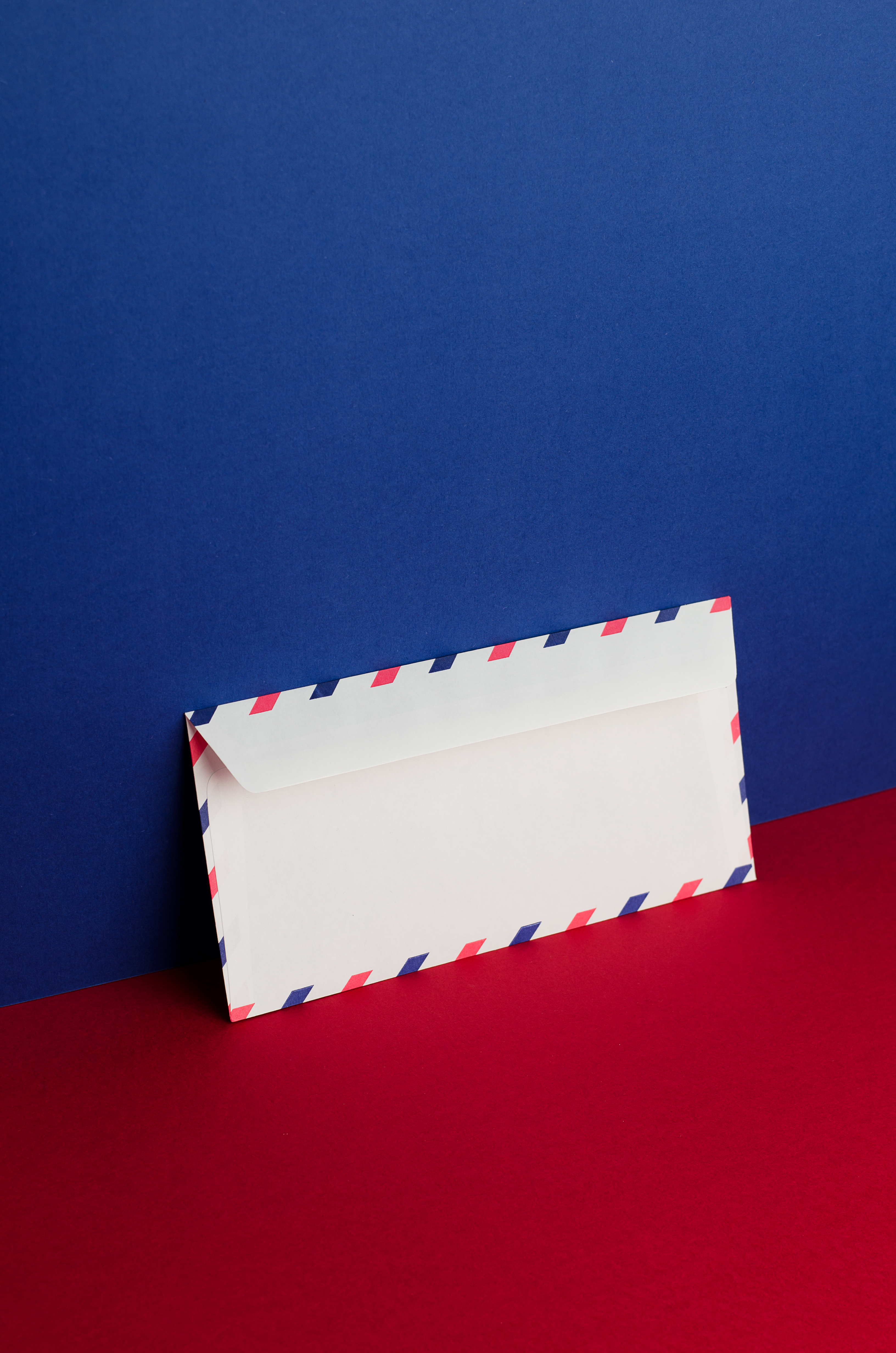 Photo of an envelope on a red and blue background