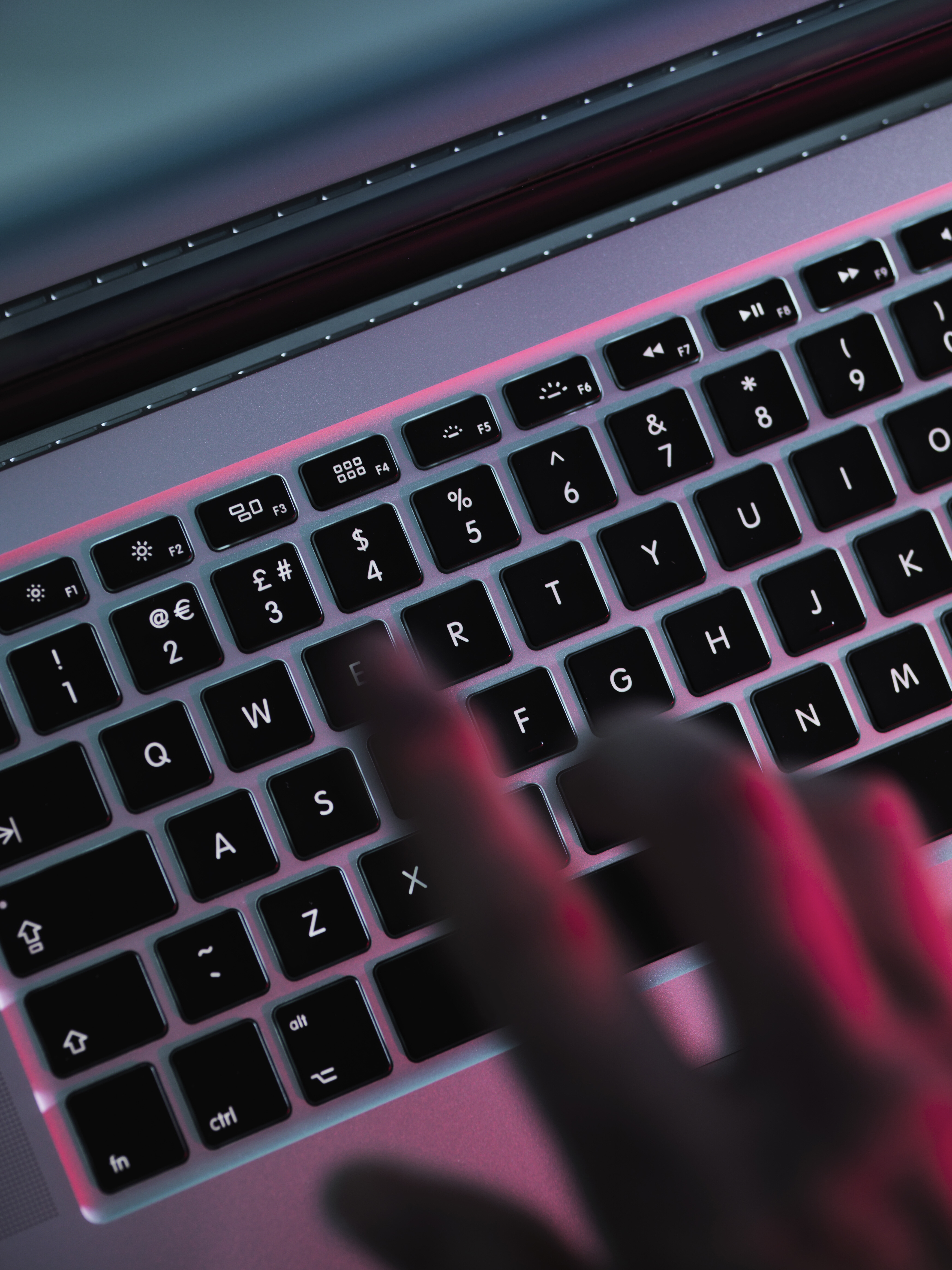 fingers hovering over a keyboard