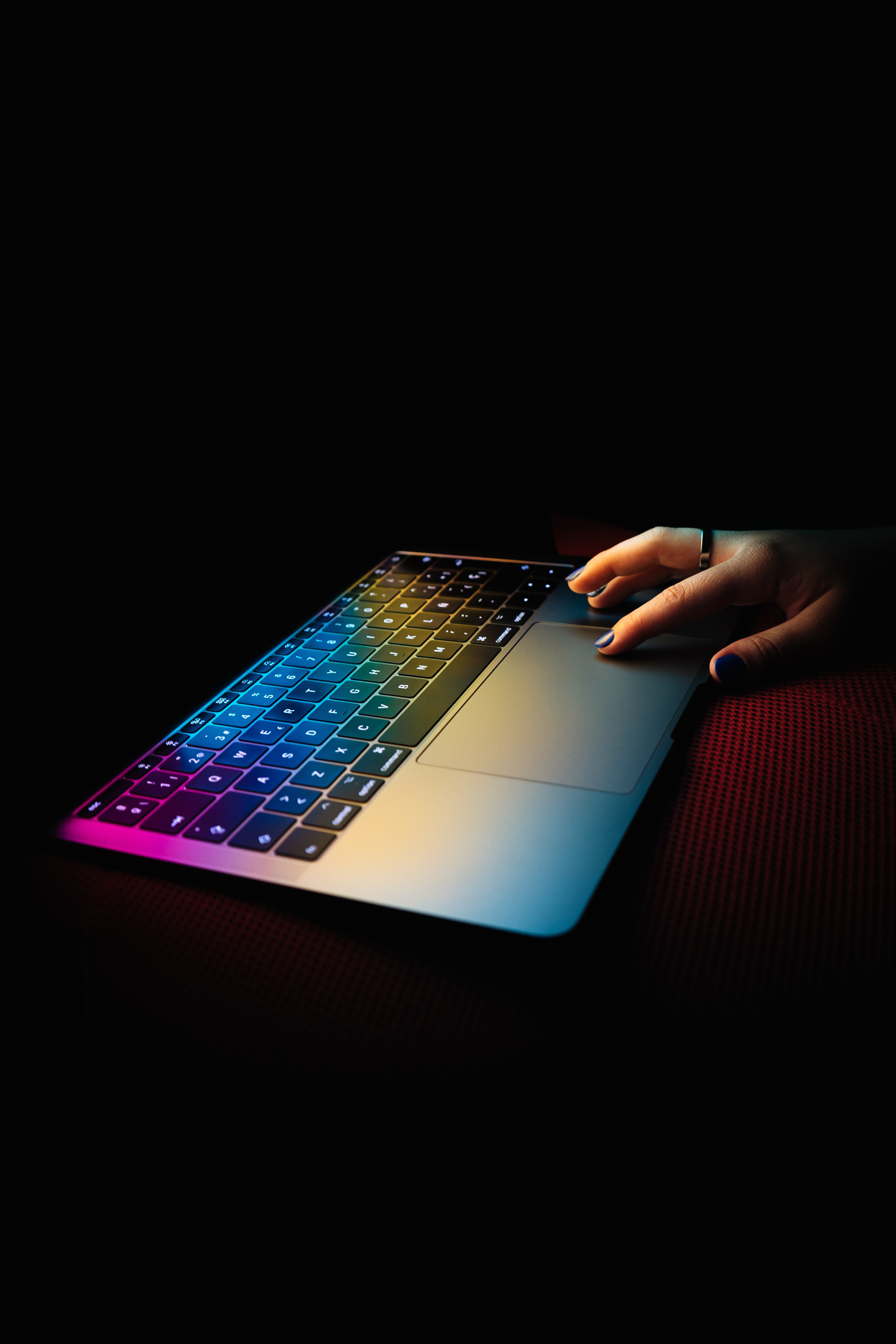 Neon screen lighting up a keyboard