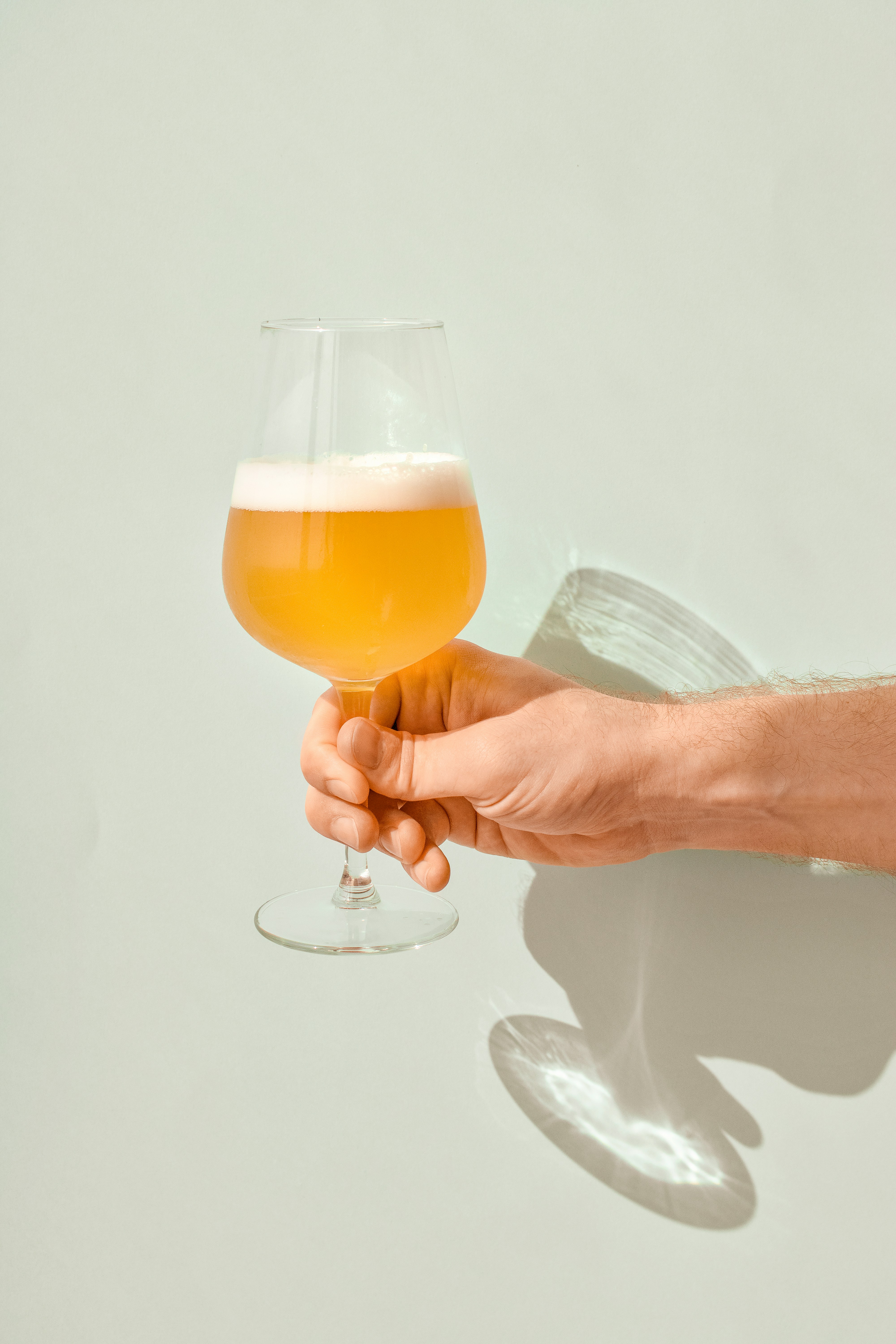 Photo of a person holding a beer